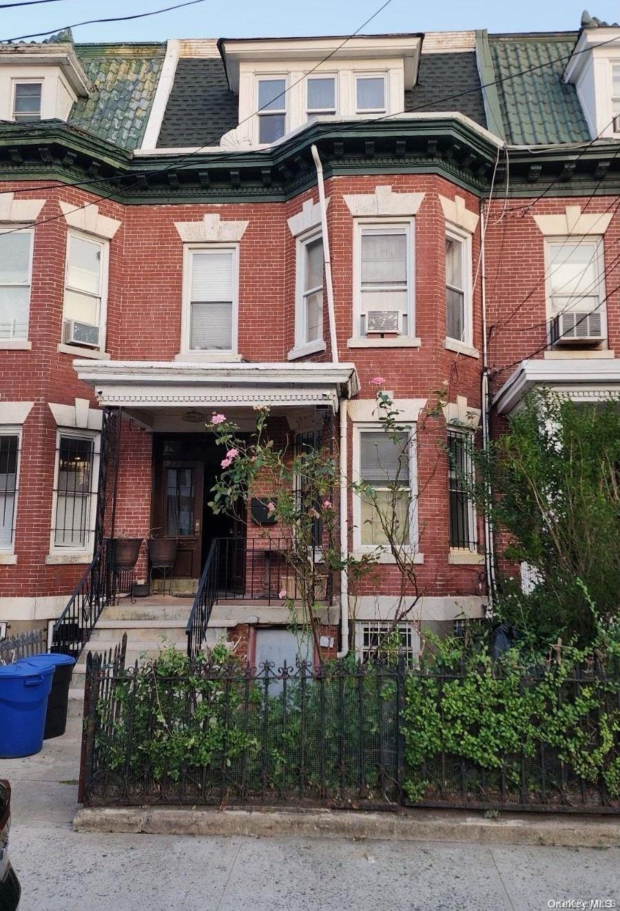 776 Hewitt Place Bronx, NY 10455 - Photo 1 of 20 a front view of a house with garden