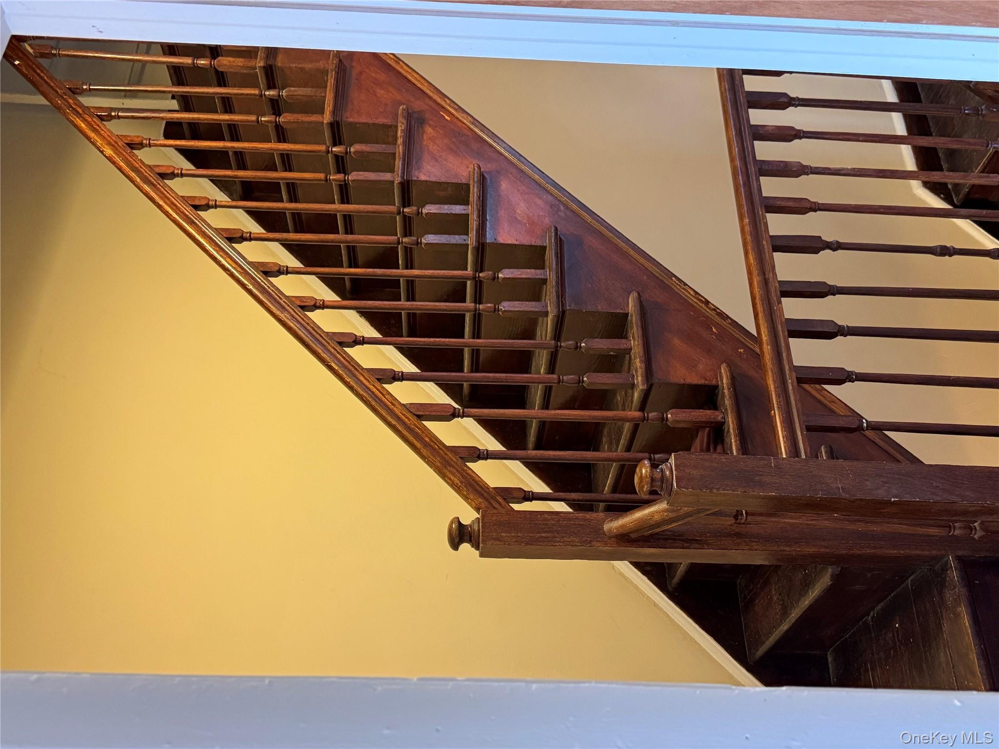 776 Hewitt Place Bronx, NY 10455 - Photo 14 of 20 a view of staircase with railing and white walls
