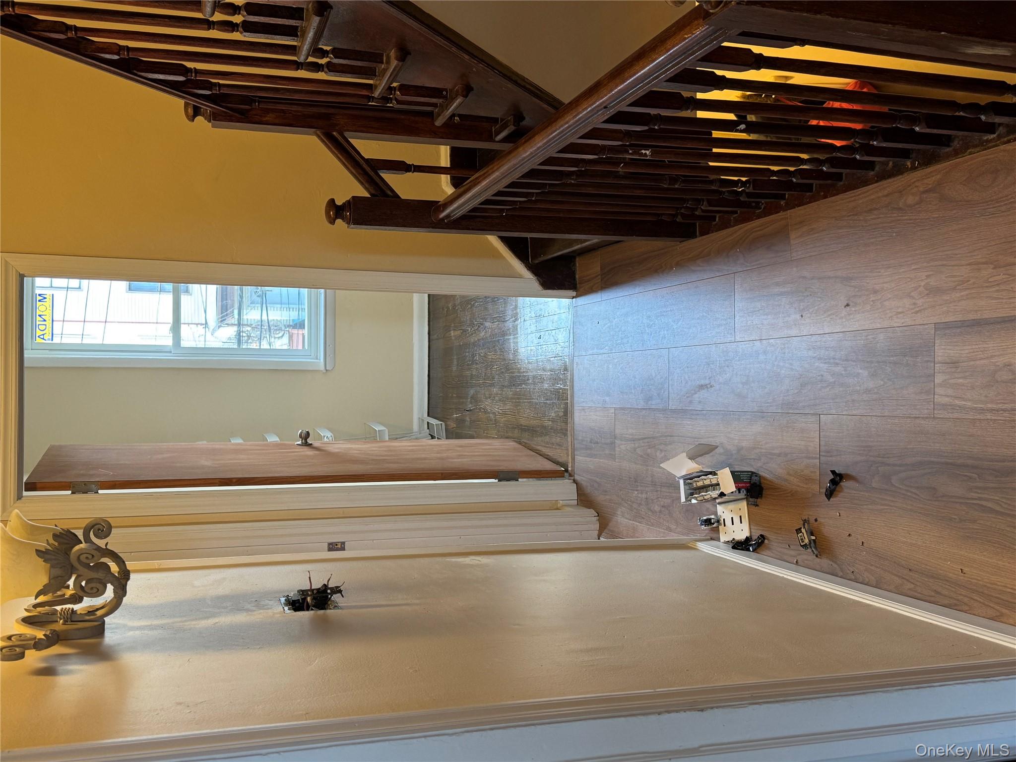 776 Hewitt Place Bronx, NY 10455 - Photo 15 of 20 a view of a hallway with wooden floor and staircase