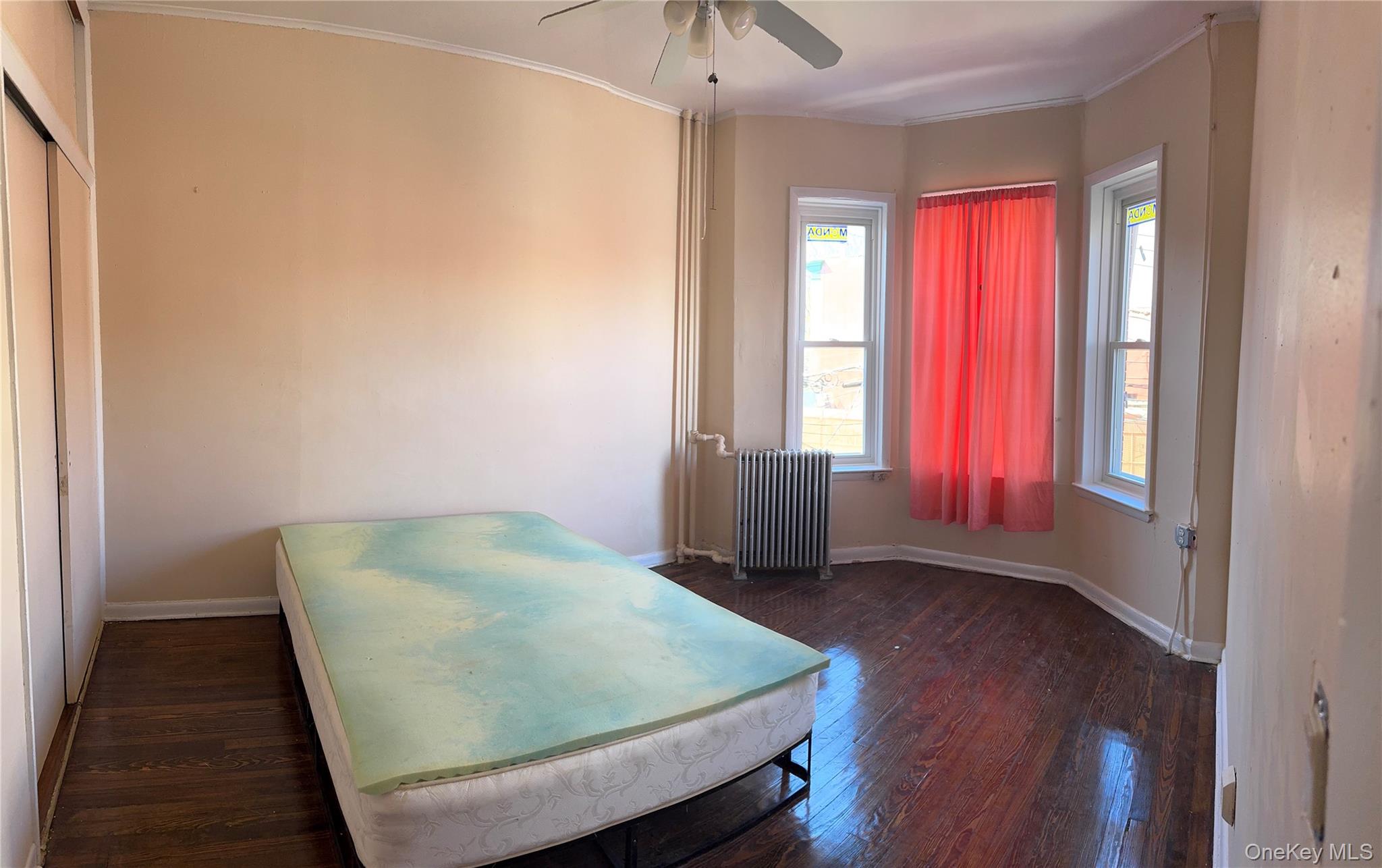 776 Hewitt Place Bronx, NY 10455 - Photo 6 of 20 a view of a room with window and wooden floor