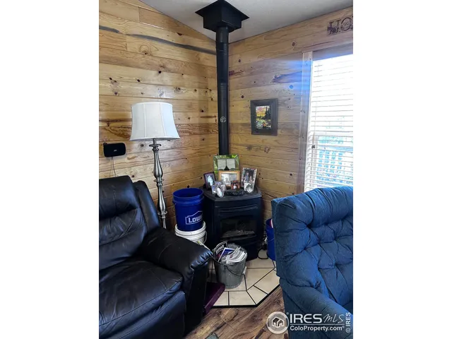 a living room with furniture and a lamp