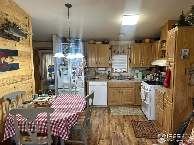 a kitchen with a sink appliances and cabinets