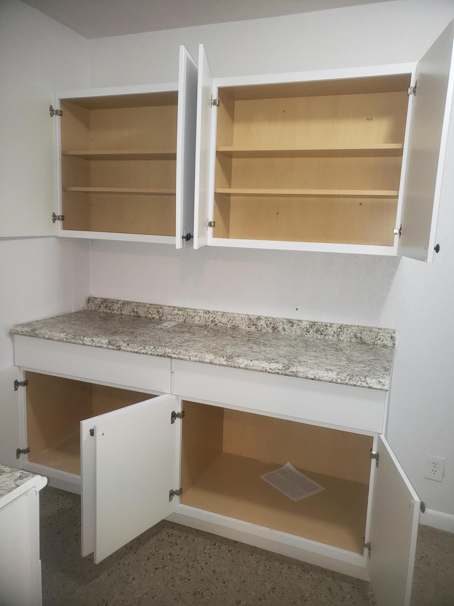 919 6th Street, Unit 15 West Palm Beach, FL 33401 - Photo 26 of 35 a bathroom with a granite countertop sink and a mirror