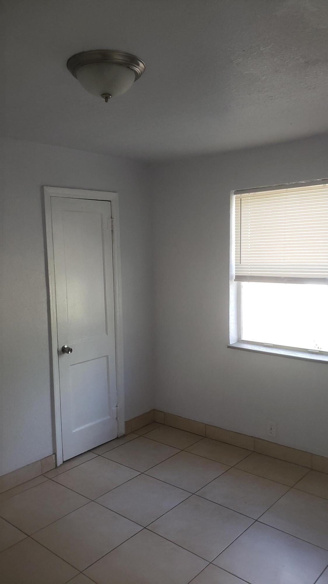919 6th Street, Unit 15 West Palm Beach, FL 33401 - Photo 30 of 35 an empty room with a window