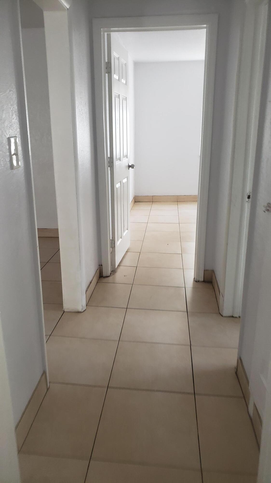 919 6th Street, Unit 15 West Palm Beach, FL 33401 - Photo 31 of 35 a view of a livingroom with an empty space and a fireplace