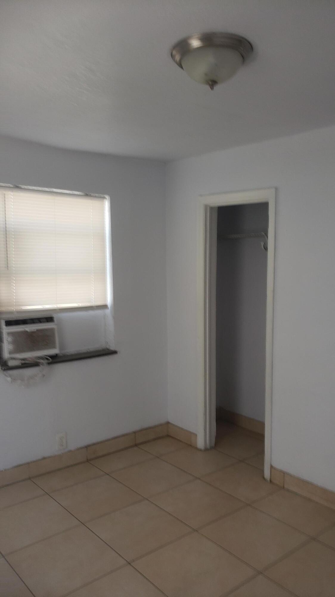 919 6th Street, Unit 15 West Palm Beach, FL 33401 - Photo 32 of 35 an empty room with windows