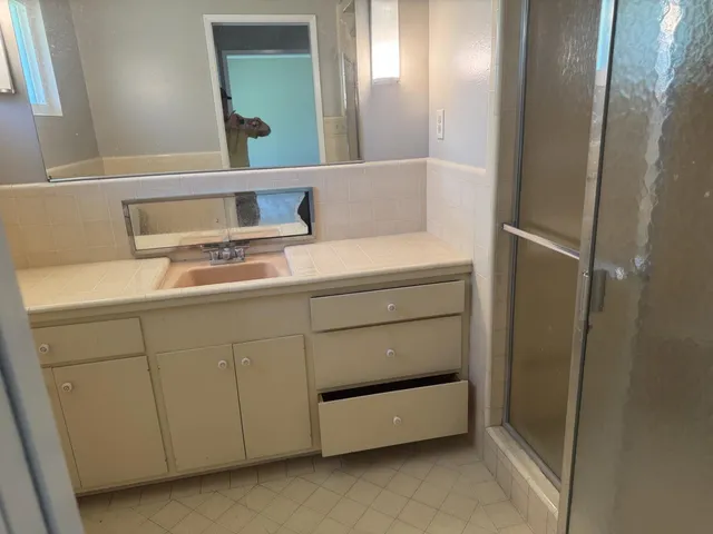 a bathroom with a sink and a mirror