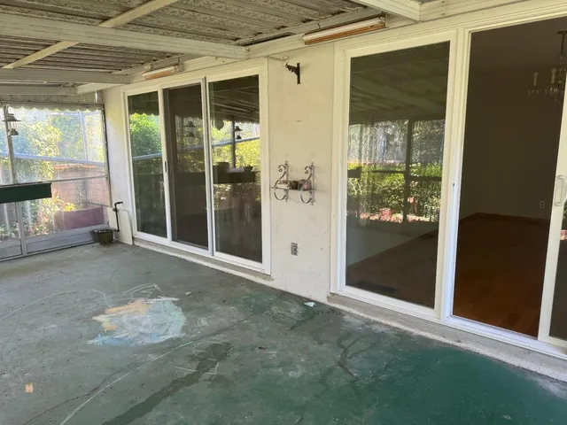 a view of backyard with large window