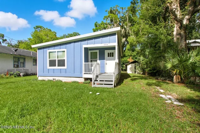 a backyard of a house with seating space