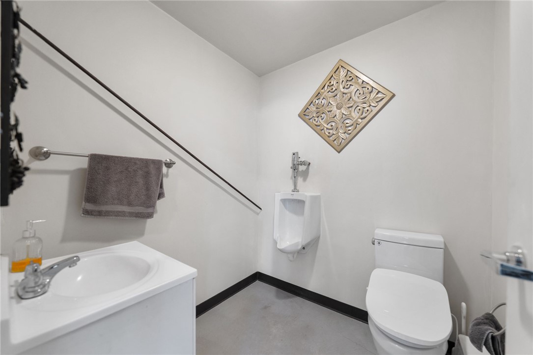 35825 Meadow Ridge Road Temecula, CA 92592 - Photo 63 of 75 a white toilet sitting next to a bathroom sink