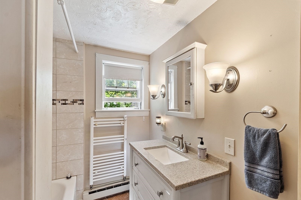 31 Pinedale Road Athol, MA 01331 - Photo 17 of 41 a bathroom with a sink a toilet and a window