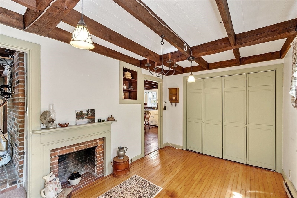 31 Pinedale Road Athol, MA 01331 - Photo 8 of 41 a view of an empty room with wooden floor and a fireplace