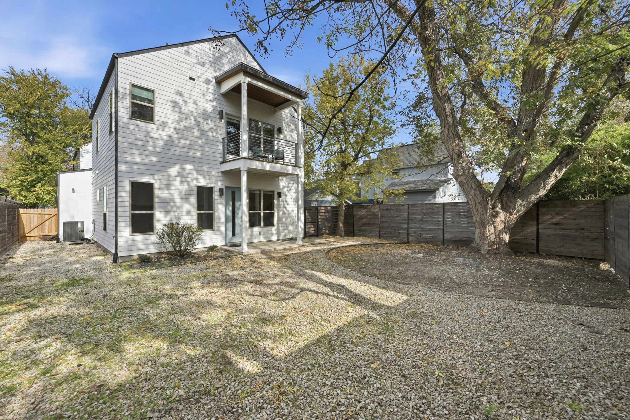 2811 Garwood Street, Unit B Austin, TX 78702 - Photo 2 of 25 a view of a big house with a tree and a yard