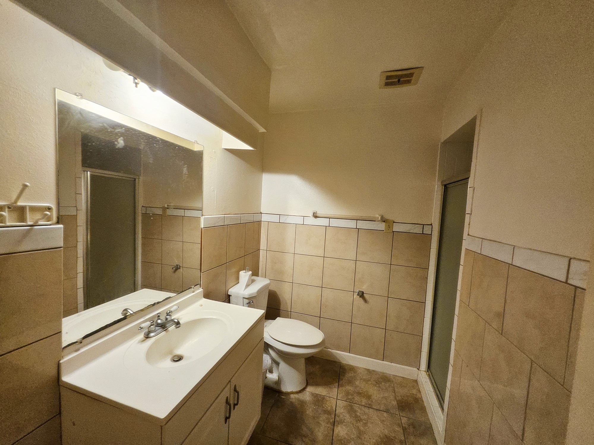 9318 Neff Street Houston, TX 77036 - Photo 5 of 10 a bathroom with a sink toilet and shower