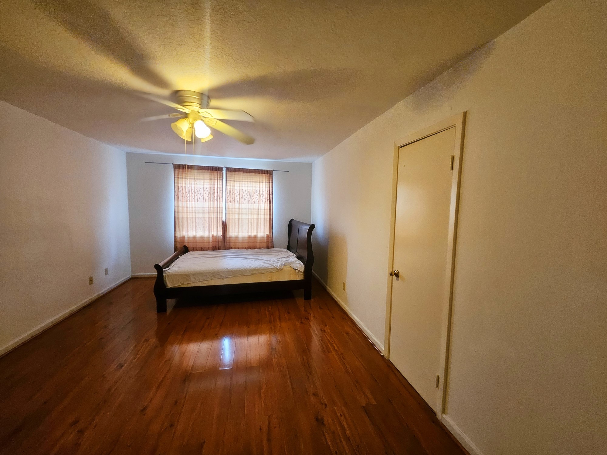 9318 Neff Street Houston, TX 77036 - Photo 6 of 10 a view of livingroom with furniture wooden floor and window