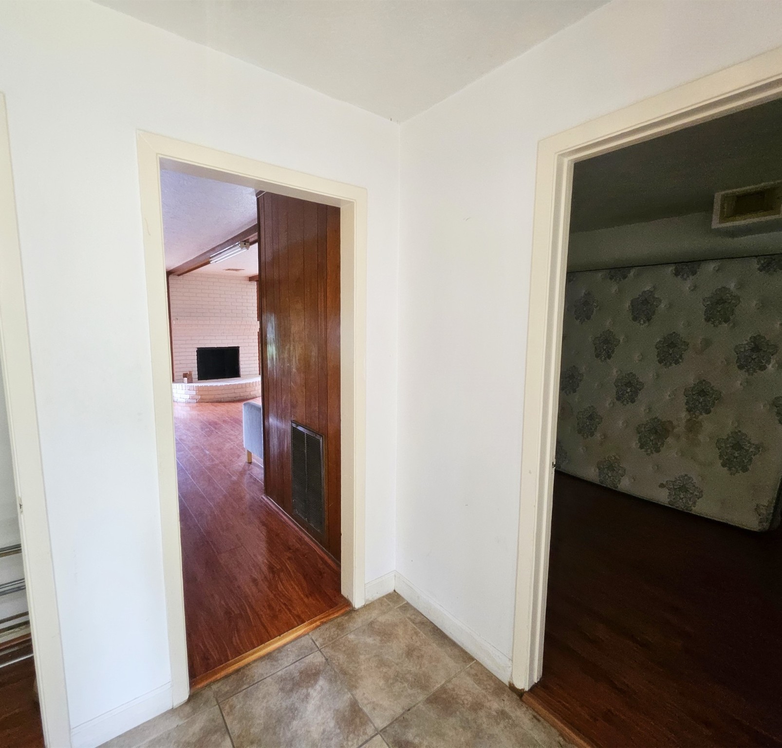 9318 Neff Street Houston, TX 77036 - Photo 9 of 10 a view of a hallway with wooden floor and a living room
