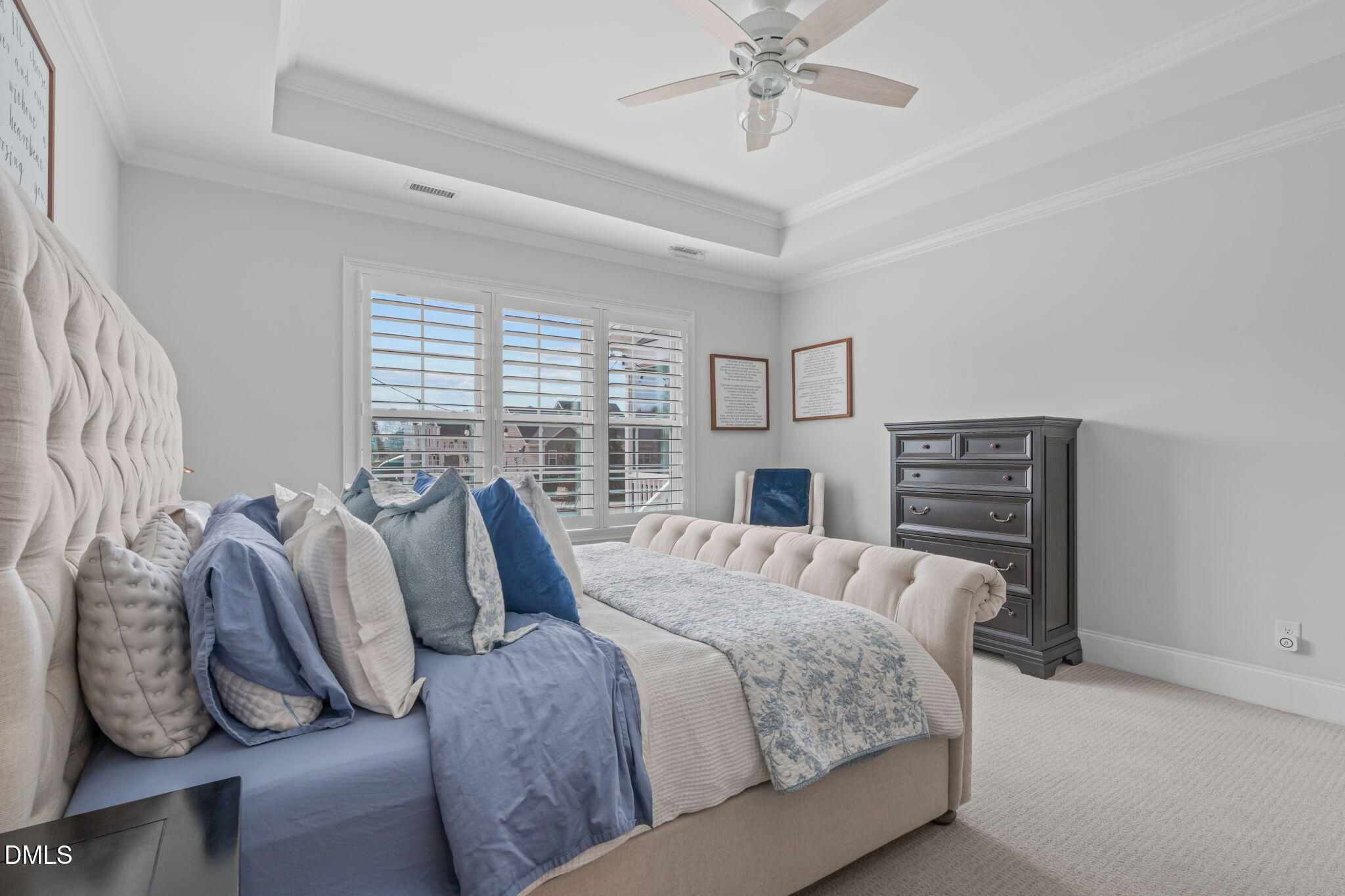 4144 Olde Judd Drive Willow Spring, NC 27592 - Photo 17 of 52 a bedroom with a bed and a chandelier