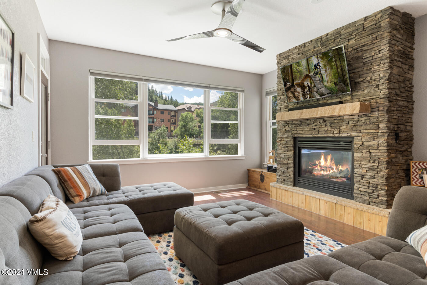 170 Hurd, Unit C102 Avon, CO 81620 - Photo 6 of 29 a living room with furniture and a fireplace