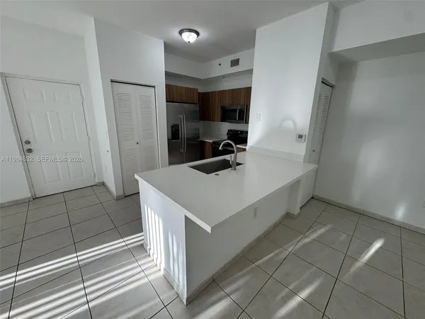 a bathroom with a sink a mirror and shower