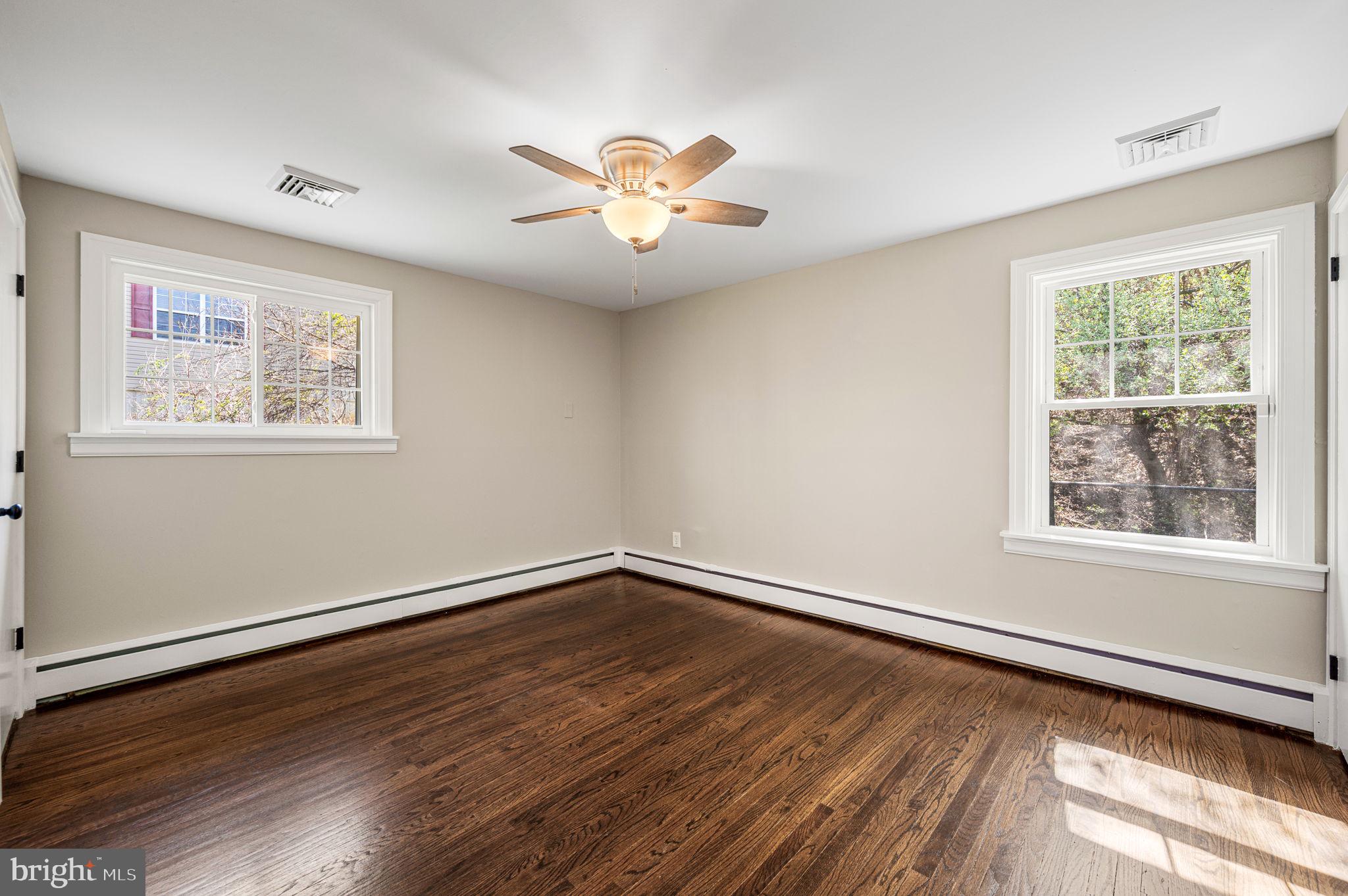 2299 Springhouse Lane Aston, PA 19014 - Photo 16 of 28 a view of an empty room with wooden floor and a window