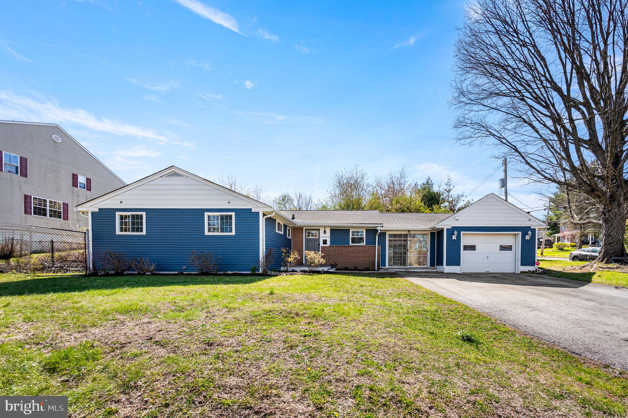 2299 Springhouse Lane Aston, PA 19014 - Photo 24 of 28 a view of a house with a big yard and large trees