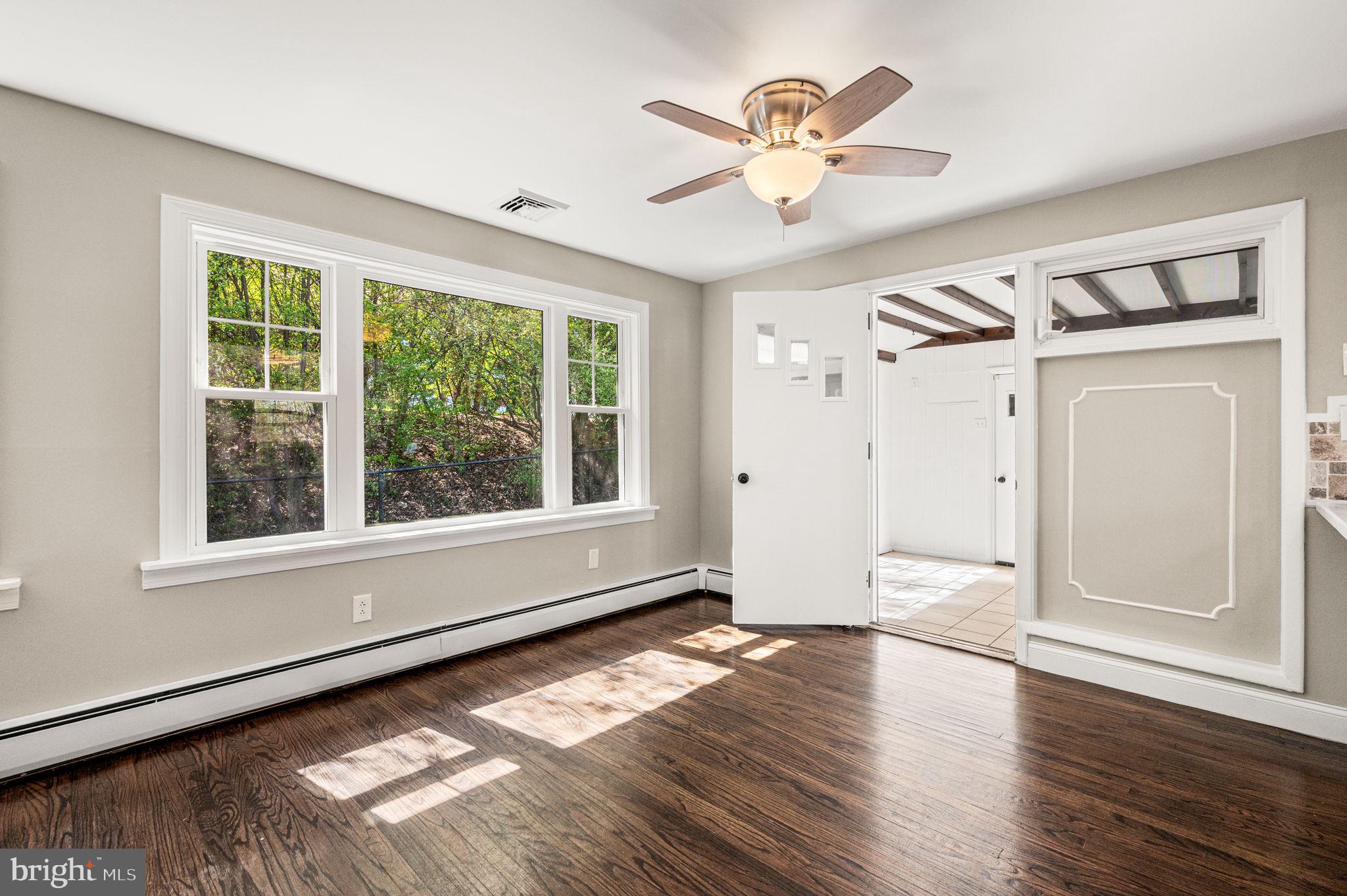 2299 Springhouse Lane Aston, PA 19014 - Photo 9 of 28 a view of empty room with wooden floor and fan