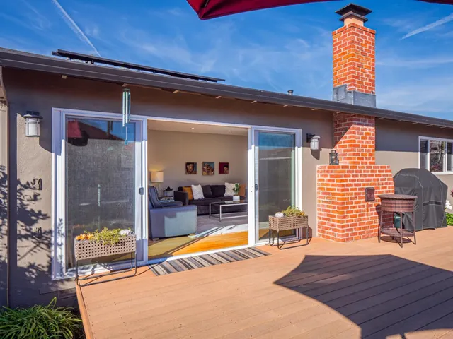 a view of a balcony with chair and glass door