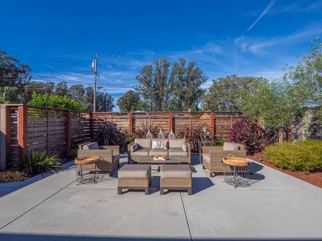 a outdoor space with lots of water view and sitting space