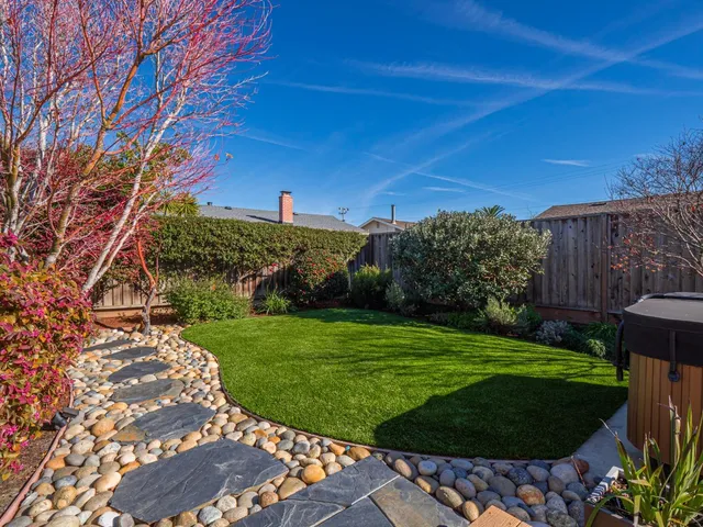 a view of a backyard with green space