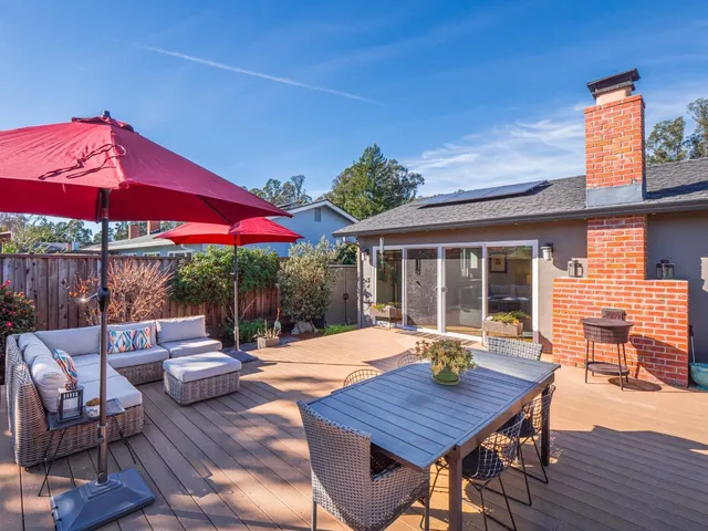a outdoor space with furniture and wooden floor