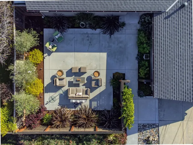 a view of chairs and table in patio