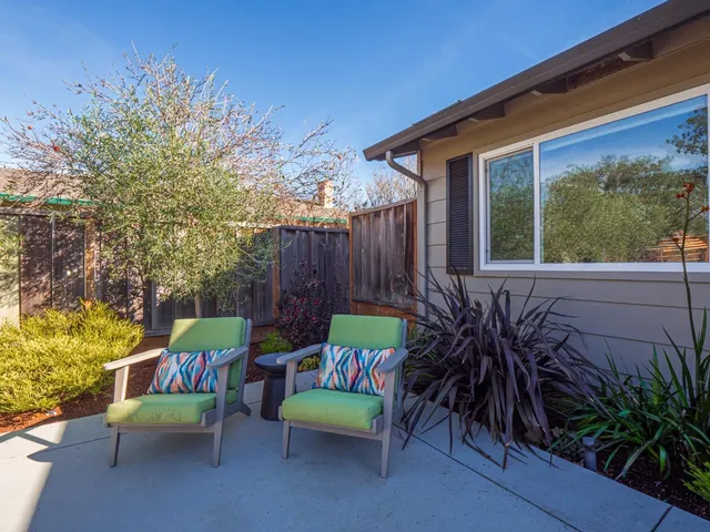 a outdoor space with patio the couches and potted plants with sky view