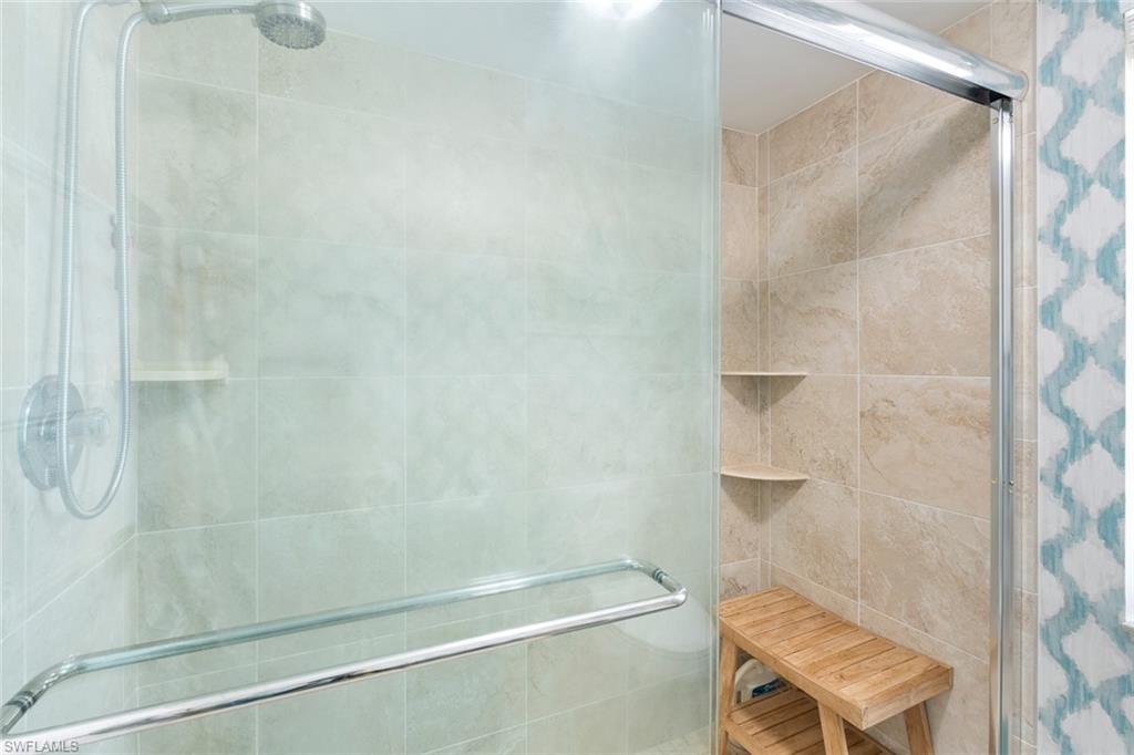 159 Quails Nest Road, Unit 1084 Naples, FL 34112 - Photo 17 of 21 a bathroom with a shower