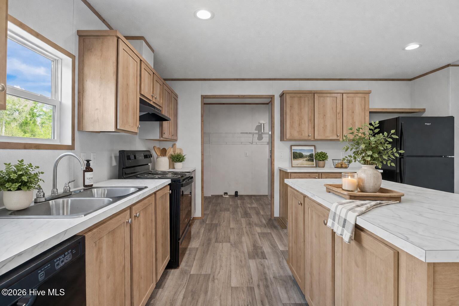 1755 Lynch Road Hollister, NC 27844 - Photo 12 of 37 Modern farmhouse kitchen with island and