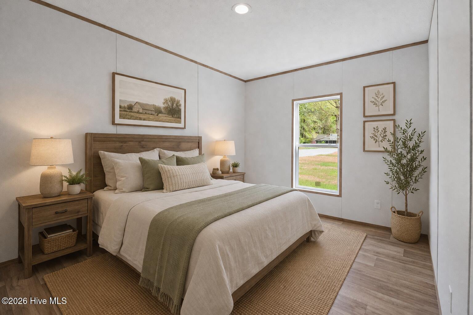 1755 Lynch Road Hollister, NC 27844 - Photo 17 of 37 Cozy minimalist bedroom with natural acc