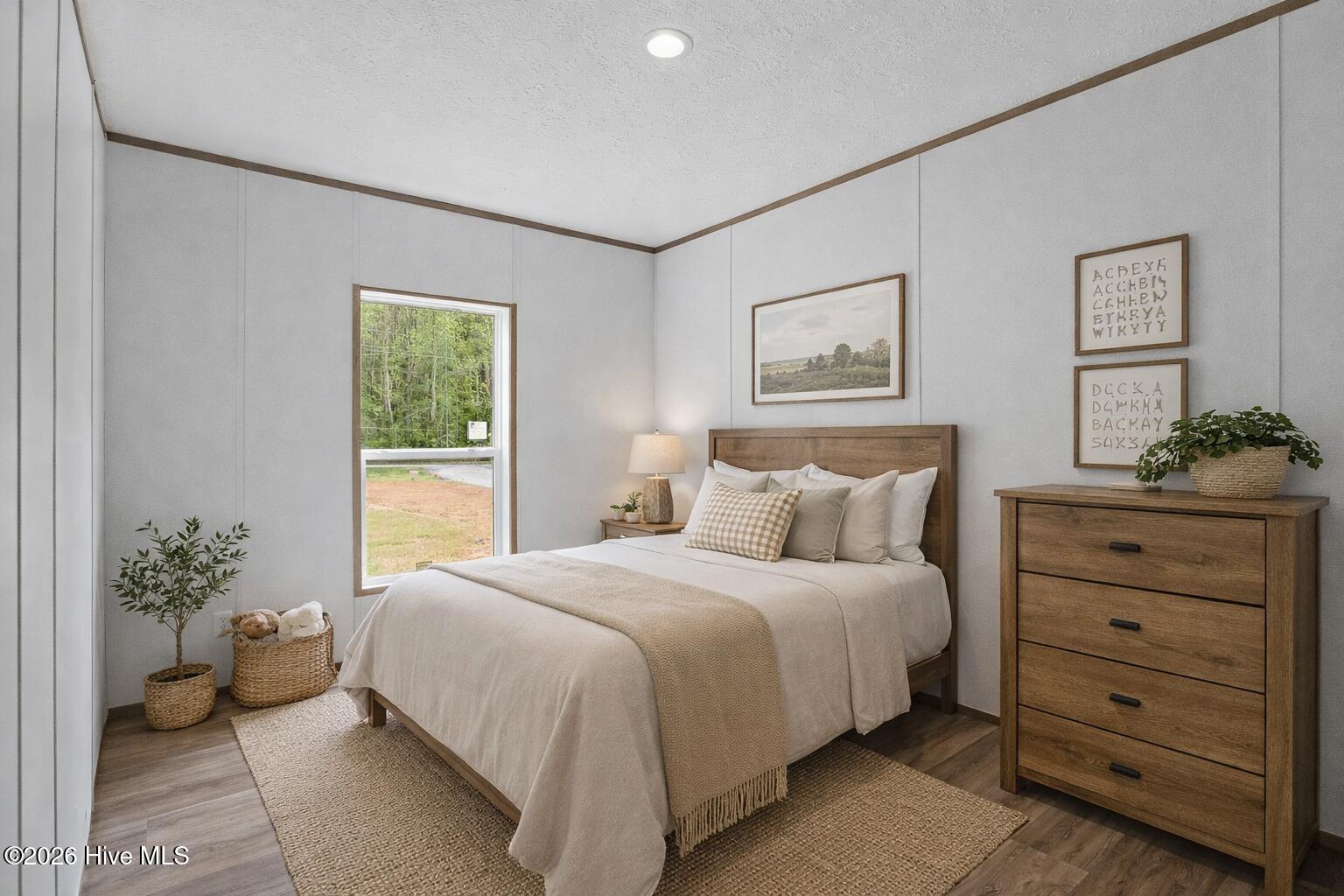 1755 Lynch Road Hollister, NC 27844 - Photo 20 of 37 Cozy farmhouse bedroom with natural ligh