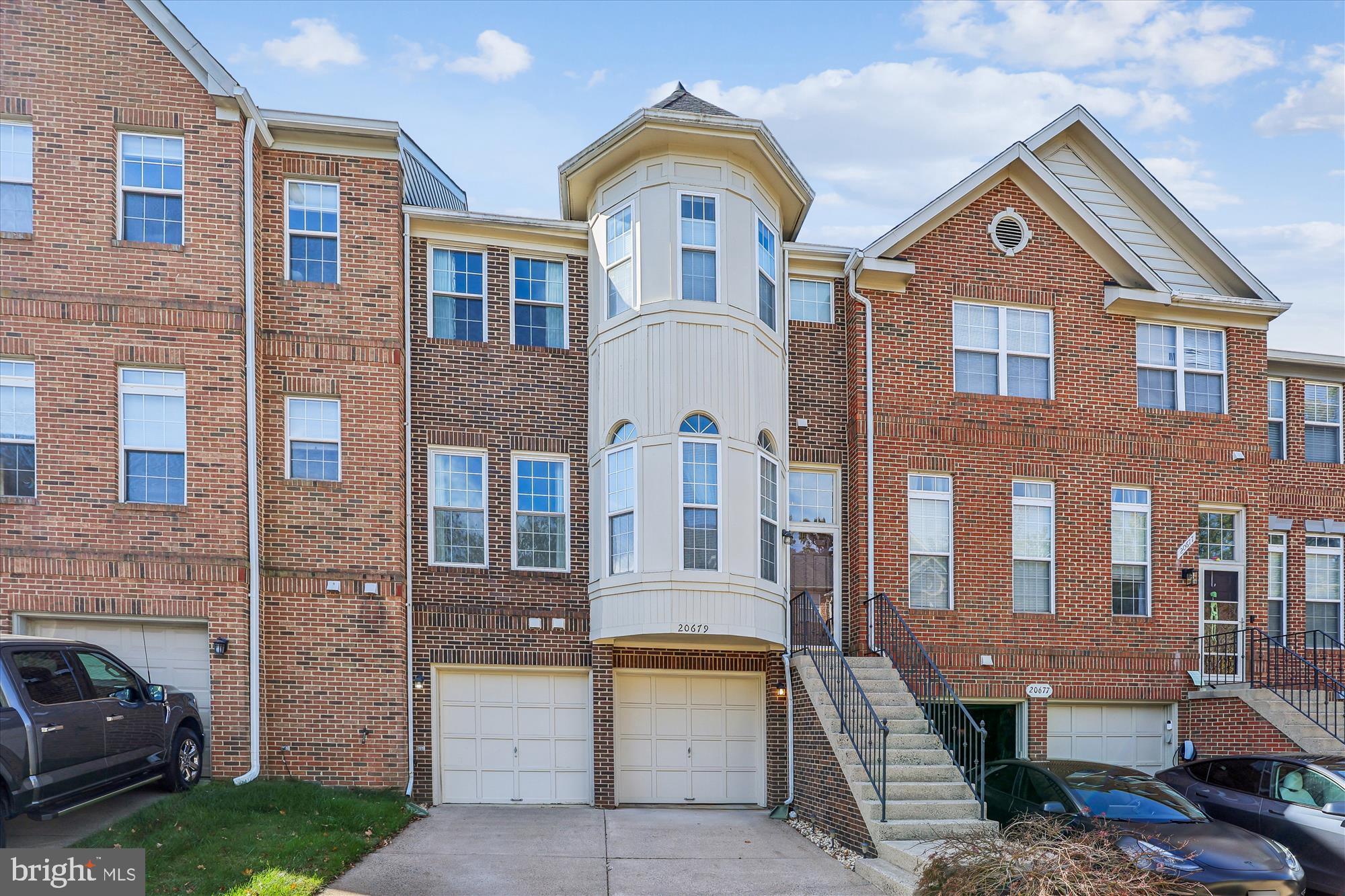 20679 Riptide Square Sterling, VA 20165 - Photo 1 of 43 a front view of a house with a garden