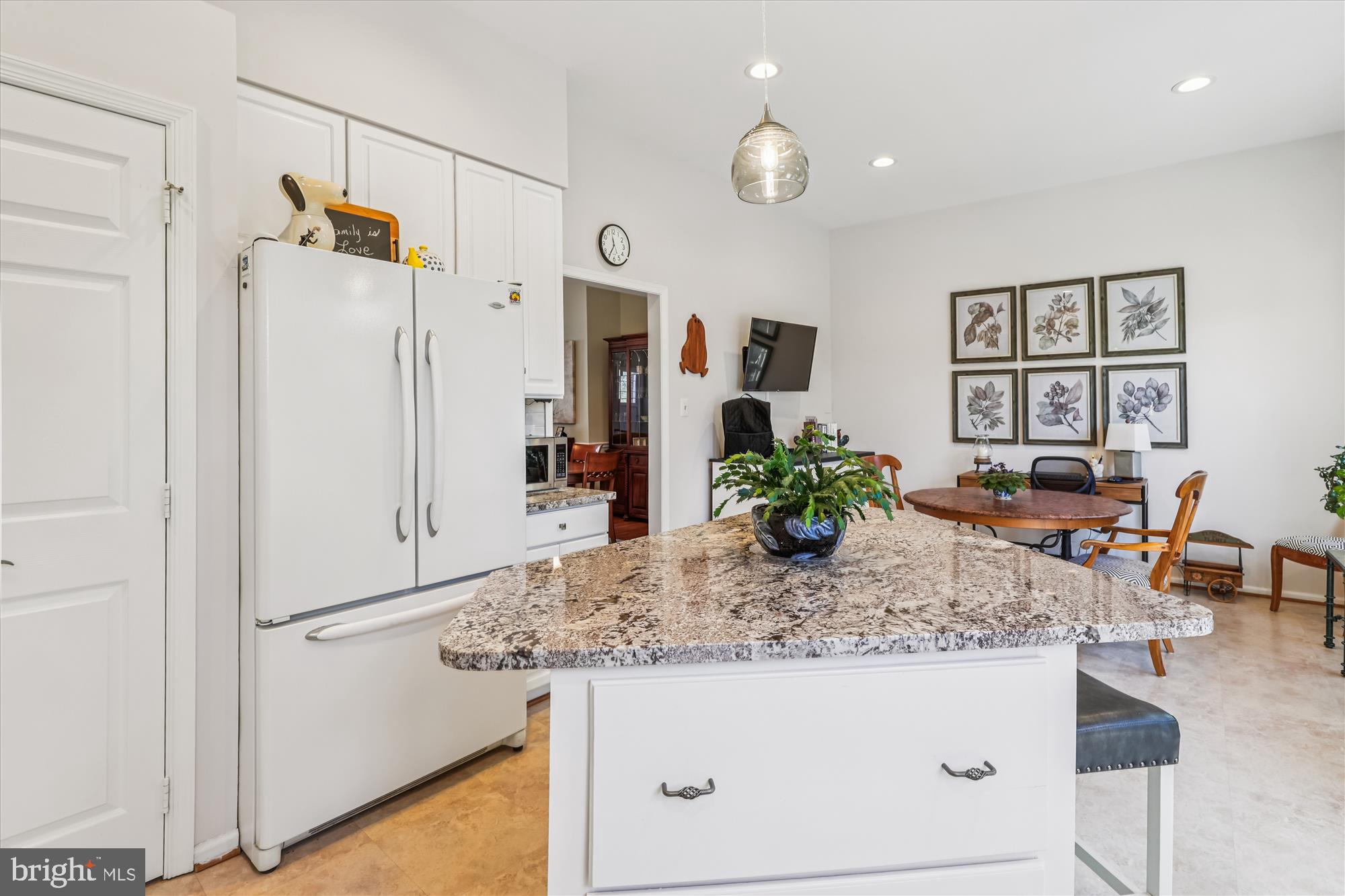 20679 Riptide Square Sterling, VA 20165 - Photo 13 of 43 a kitchen with stainless steel appliances granite countertop a refrigerator and a stove