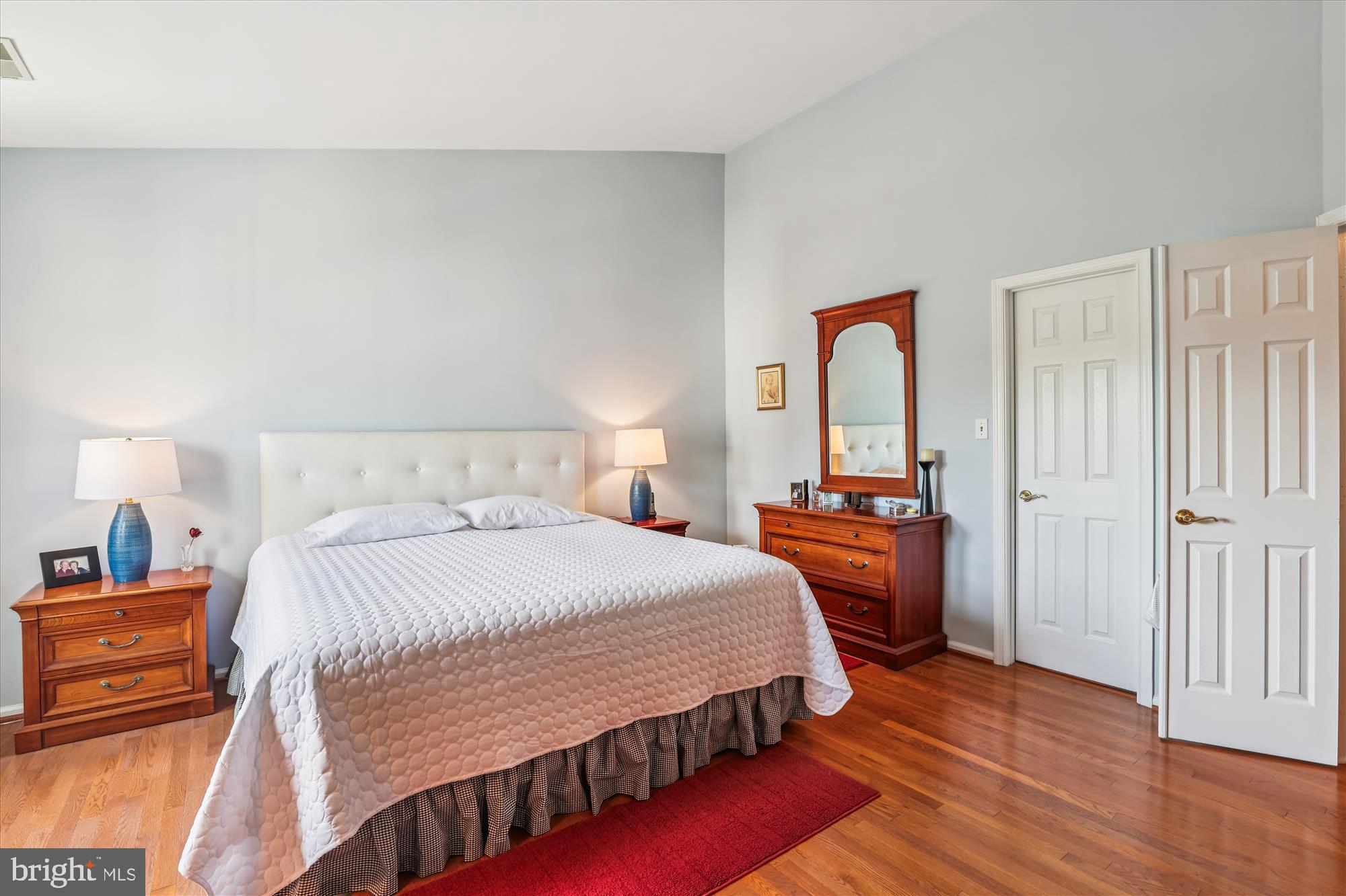 20679 Riptide Square Sterling, VA 20165 - Photo 21 of 43 a bedroom with a bed and wooden floor