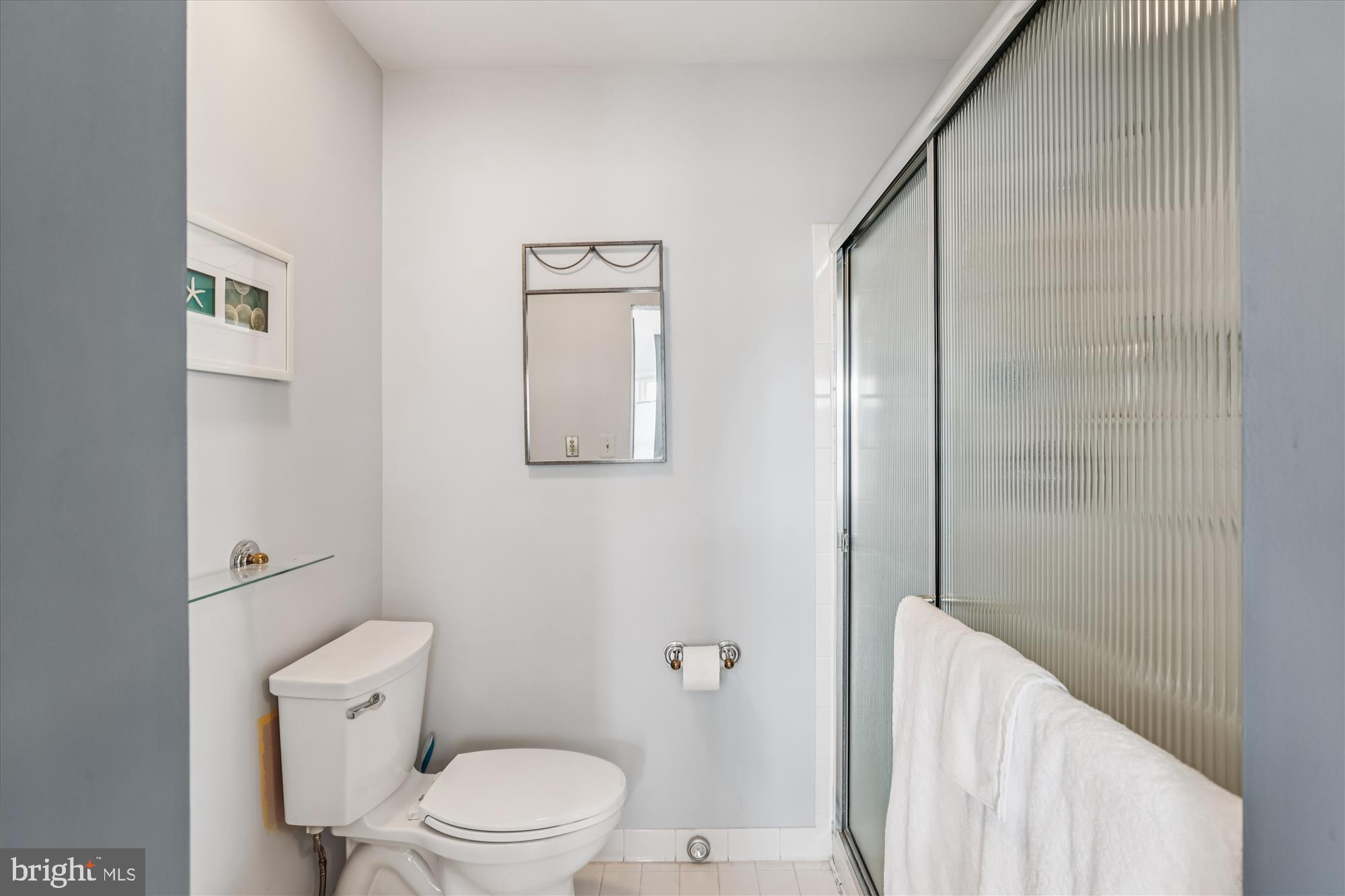20679 Riptide Square Sterling, VA 20165 - Photo 25 of 43 a white toilet sitting next to a bathroom sink