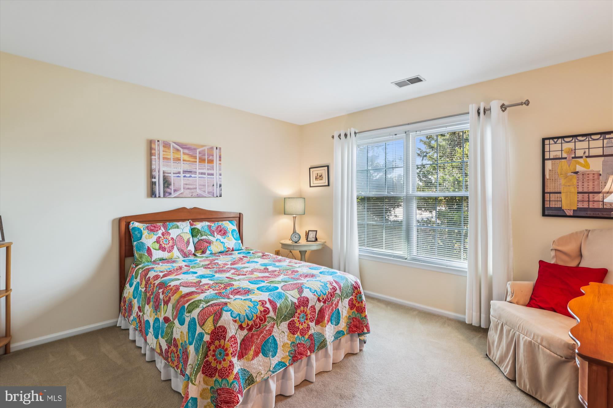 20679 Riptide Square Sterling, VA 20165 - Photo 27 of 43 a bedroom with a bed and glass window
