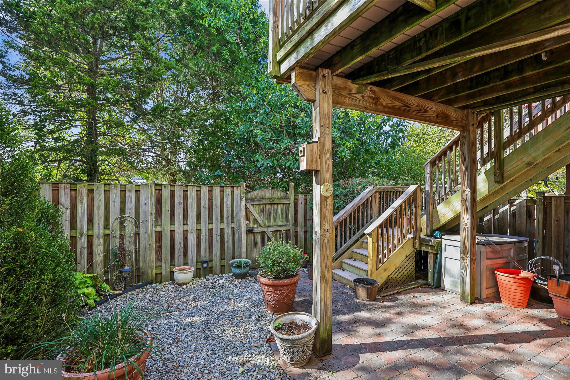 20679 Riptide Square Sterling, VA 20165 - Photo 42 of 43 a view of a deck with table and chairs a barbeque with wooden floor and roof