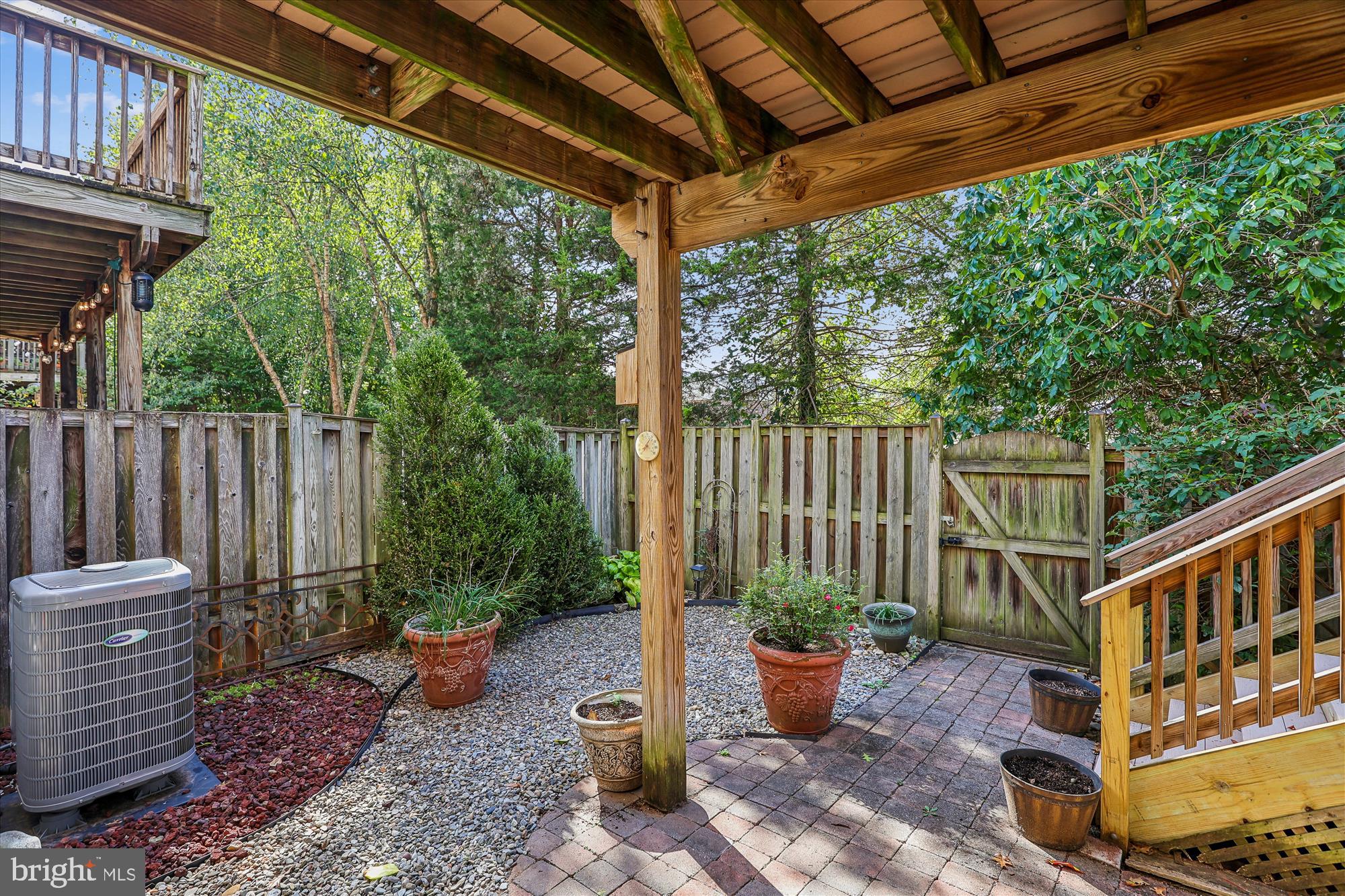 20679 Riptide Square Sterling, VA 20165 - Photo 43 of 43 a view of a deck with chairs and wooden fence