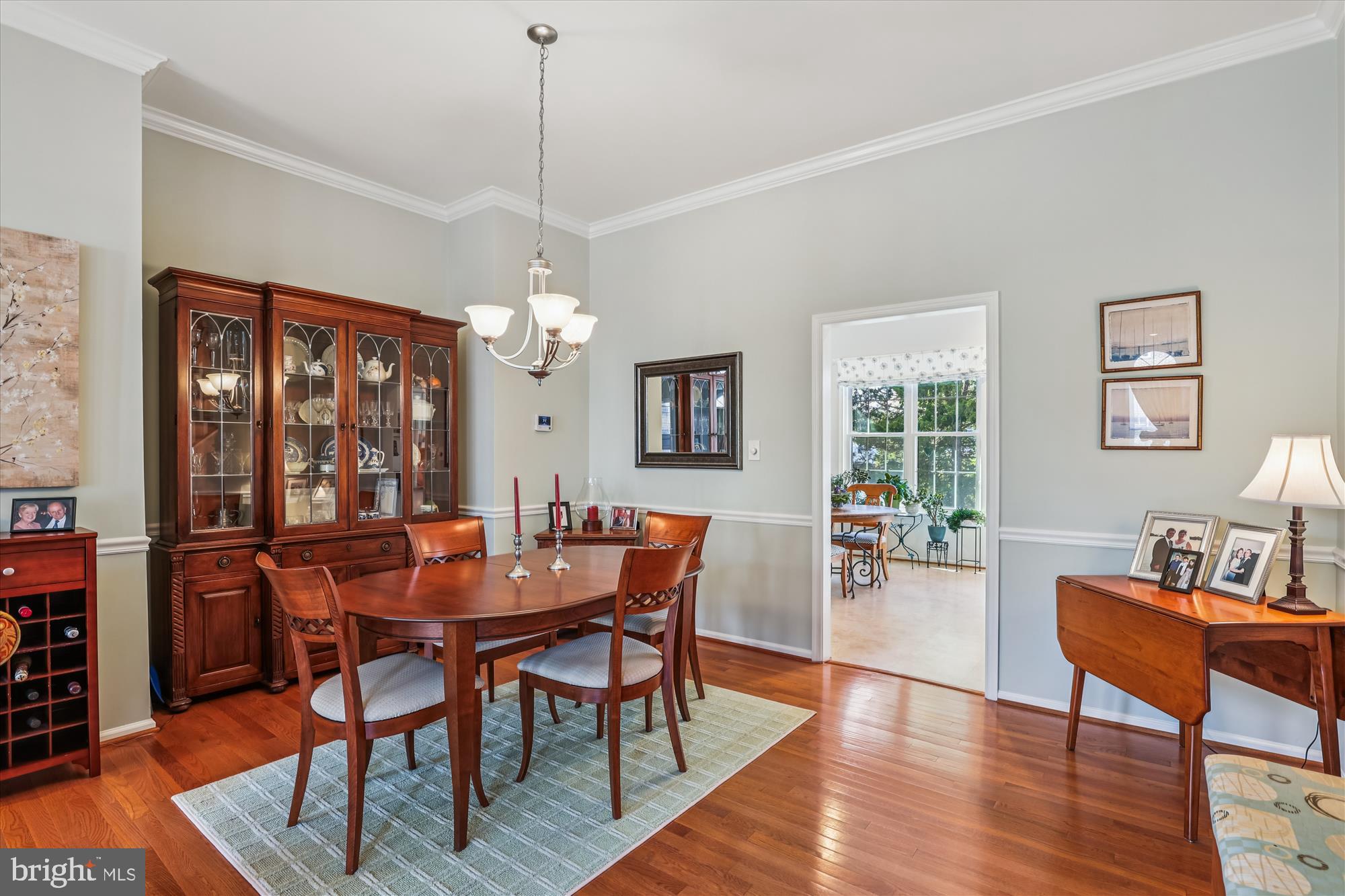 20679 Riptide Square Sterling, VA 20165 - Photo 7 of 43 a view of a dining room with furniture window and wooden floor