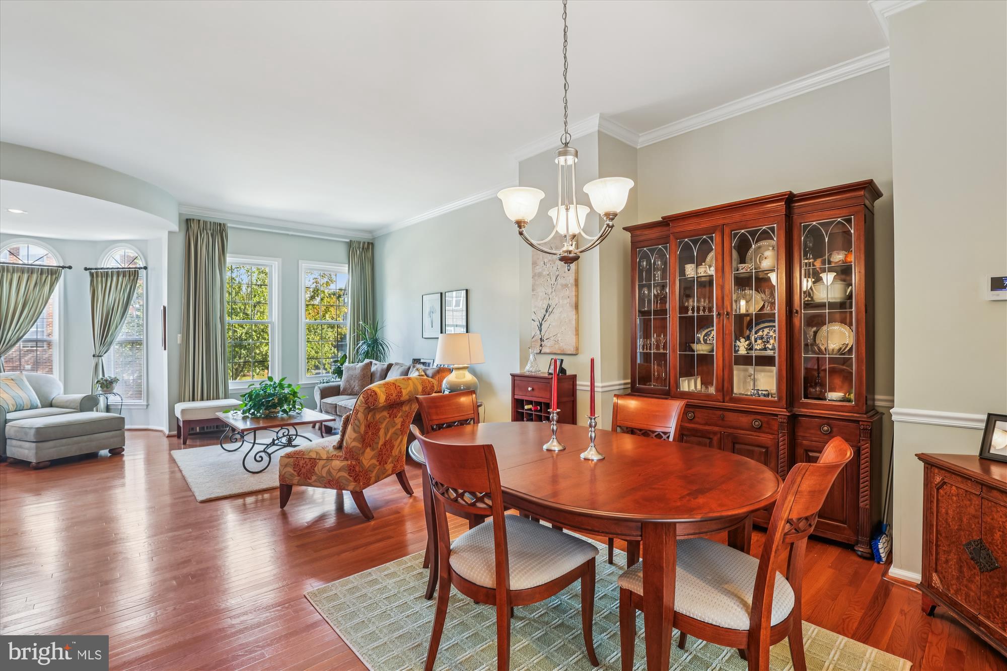 20679 Riptide Square Sterling, VA 20165 - Photo 9 of 43 a view of a dining room with furniture wooden floor and chandelier