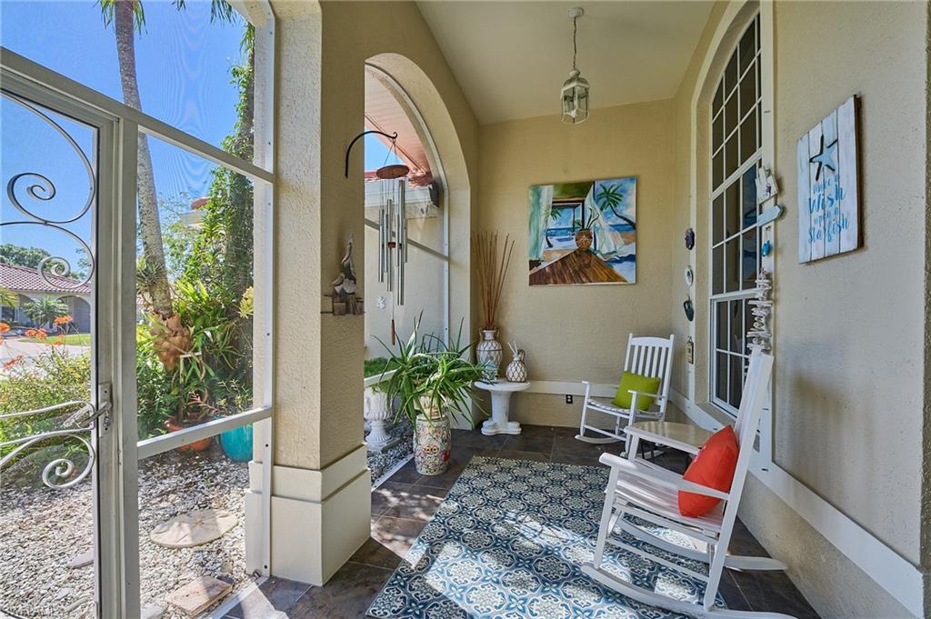 186 Muirfield Circle Naples, FL 34113 - Photo 27 of 36 a room with furniture and a potted plant