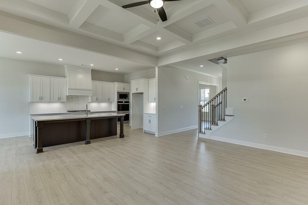 454 Thunder Road Buford, GA 30518 - Photo 14 of 78 a view of kitchen with refrigerator and window