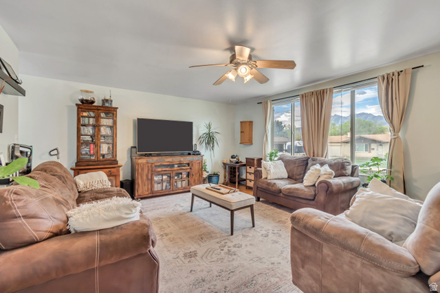7470 Ramanee Drive Midvale, UT 84047 - Photo 4 of 29 Living area with ceiling fan