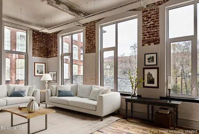 a living room with furniture and windows