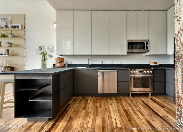 a kitchen with a sink and cabinets